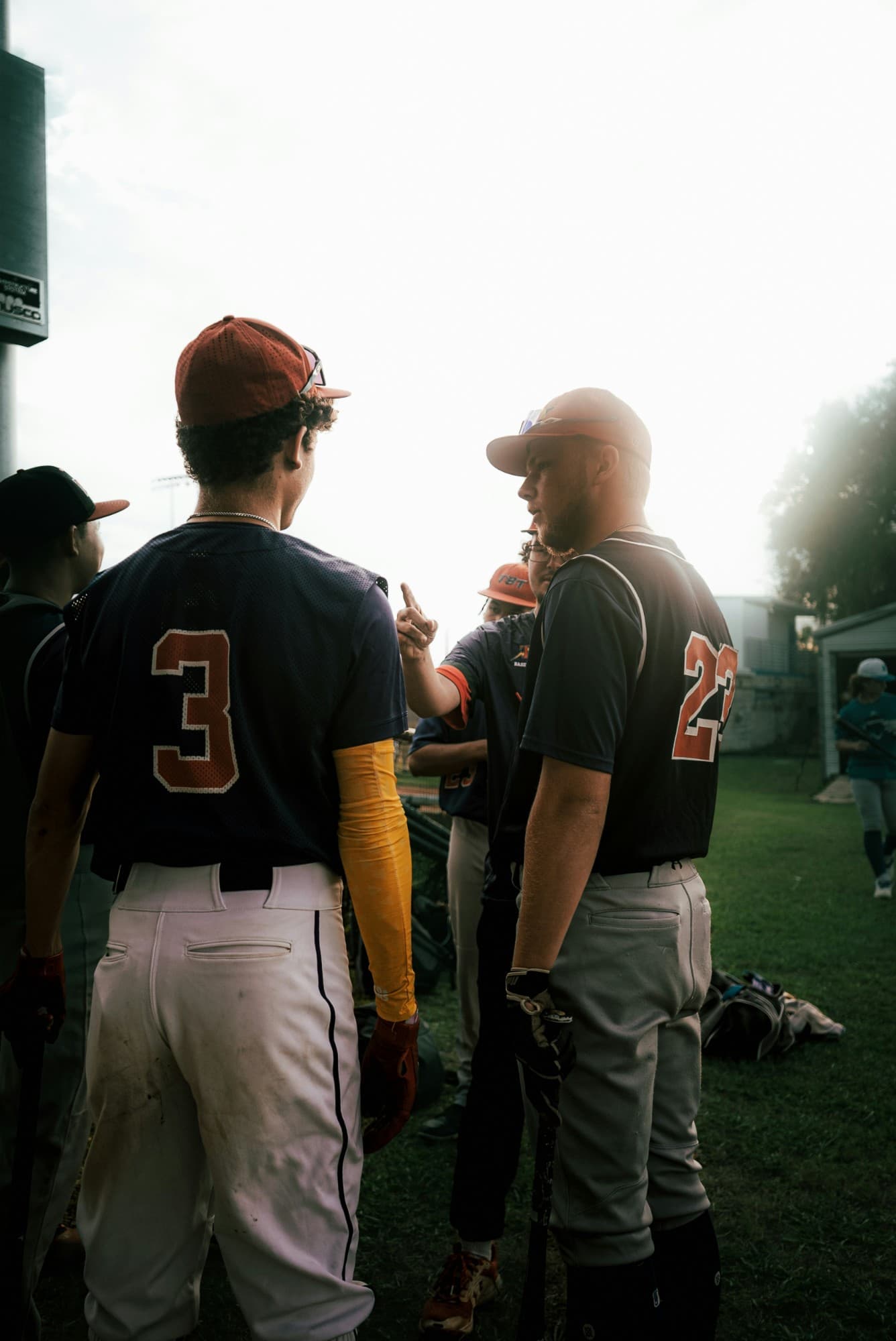 Baseball teammates talking on the field before a game